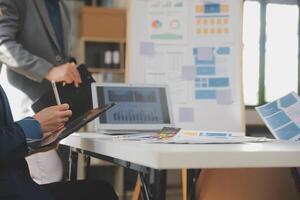 Close up ux developer and ui designer use augmented reality brainstorming about mobile app interface wireframe design on desk at modern office.Creative digital development agency photo