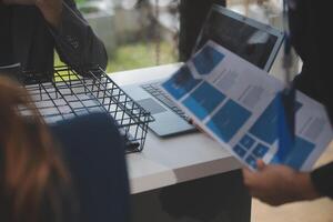 Close up ux developer and ui designer use augmented reality brainstorming about mobile app interface wireframe design on desk at modern office.Creative digital development agency photo