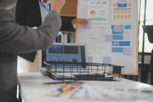Close up ux developer and ui designer use augmented reality brainstorming about mobile app interface wireframe design on desk at modern office.Creative digital development agency photo