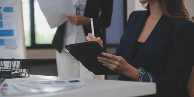 Close up ux developer and ui designer use augmented reality brainstorming about mobile app interface wireframe design on desk at modern office.Creative digital development agency photo