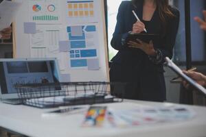 Close up ux developer and ui designer use augmented reality brainstorming about mobile app interface wireframe design on desk at modern office.Creative digital development agency photo