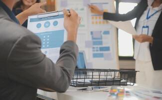 Close up ux developer and ui designer use augmented reality brainstorming about mobile app interface wireframe design on desk at modern office.Creative digital development agency photo