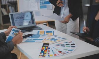 Close up ux developer and ui designer use augmented reality brainstorming about mobile app interface wireframe design on desk at modern office.Creative digital development agency photo