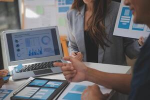 Close up ux developer and ui designer use augmented reality brainstorming about mobile app interface wireframe design on desk at modern office.Creative digital development agency photo