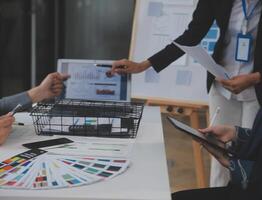 Close up ux developer and ui designer use augmented reality brainstorming about mobile app interface wireframe design on desk at modern office.Creative digital development agency photo