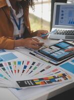 Close up ux developer and ui designer use augmented reality brainstorming about mobile app interface wireframe design on desk at modern office.Creative digital development agency photo