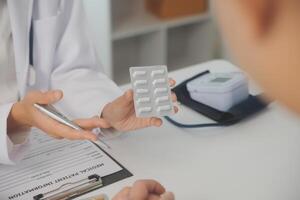 Healthcare service and pharmacy worker with customer at store counter for medication explanation. Pharmaceutical advice and opinion of pharmacist helping girl with medicine information. photo