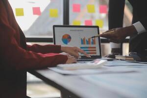 Finance manager meeting discussing company growth project success financial statistics, professional investor working start up project for strategy plan with document, laptop and digital tablet. photo