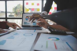 Finance manager meeting discussing company growth project success financial statistics, professional investor working start up project for strategy plan with document, laptop and digital tablet. photo
