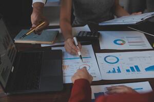 Finance manager meeting discussing company growth project success financial statistics, professional investor working start up project for strategy plan with document, laptop and digital tablet. photo
