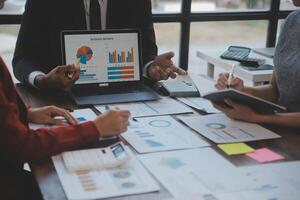 Finance manager meeting discussing company growth project success financial statistics, professional investor working start up project for strategy plan with document, laptop and digital tablet. photo
