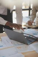 Finance manager meeting discussing company growth project success financial statistics, professional investor working start up project for strategy plan with document, laptop and digital tablet. photo