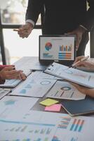 Finance manager meeting discussing company growth project success financial statistics, professional investor working start up project for strategy plan with document, laptop and digital tablet. photo