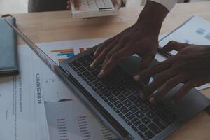 Finance manager meeting discussing company growth project success financial statistics, professional investor working start up project for strategy plan with document, laptop and digital tablet. photo