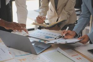 Finance manager meeting discussing company growth project success financial statistics, professional investor working start up project for strategy plan with document, laptop and digital tablet. photo