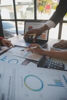 Finance manager meeting discussing company growth project success financial statistics, professional investor working start up project for strategy plan with document, laptop and digital tablet. photo