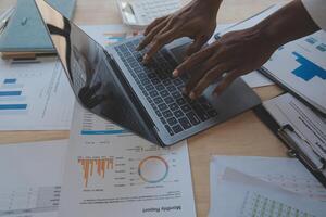 Finance manager meeting discussing company growth project success financial statistics, professional investor working start up project for strategy plan with document, laptop and digital tablet. photo