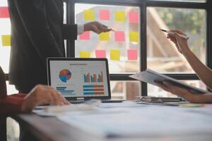 Finance manager meeting discussing company growth project success financial statistics, professional investor working start up project for strategy plan with document, laptop and digital tablet. photo