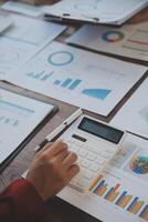 Finance manager meeting discussing company growth project success financial statistics, professional investor working start up project for strategy plan with document, laptop and digital tablet. photo