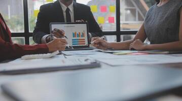 Finance manager meeting discussing company growth project success financial statistics, professional investor working start up project for strategy plan with document, laptop and digital tablet. photo