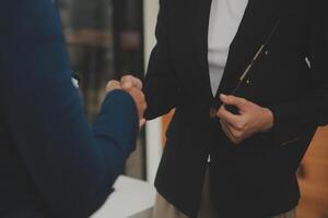 Business handshake for teamwork of business merger and acquisition,successful negotiate,hand shake,two businessman shake hand with partner to celebration partnership and business deal concept photo