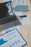 Finance manager meeting discussing company growth project success financial statistics, professional investor working start up project for strategy plan with document, laptop and digital tablet. photo