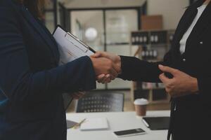 Business handshake for teamwork of business merger and acquisition,successful negotiate,hand shake,two businessman shake hand with partner to celebration partnership and business deal concept photo