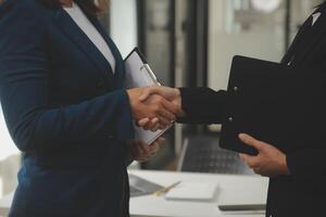 Business handshake for teamwork of business merger and acquisition,successful negotiate,hand shake,two businessman shake hand with partner to celebration partnership and business deal concept photo