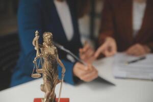 Lawyer, legal advisor, businessman brainstorming information on agreement details Business contracts in legal processing books for accuracy in contract documents. joint financial investment. photo