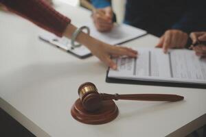 Lawyer, legal advisor, businessman brainstorming information on agreement details Business contracts in legal processing books for accuracy in contract documents. joint financial investment. photo