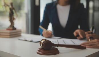Lawyer, legal advisor, businessman brainstorming information on agreement details Business contracts in legal processing books for accuracy in contract documents. joint financial investment. photo
