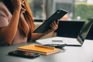 Woman is working in the office. Concept of small business. photo