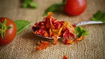 small pieces of dried tomatoes next to fresh tomatoes, natural homemade spices video