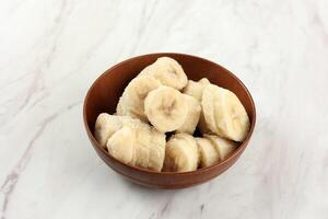 Frozen Sliced Banana on Bowl, Ingredient for Smoothies, Ice Cream, Desserts. photo