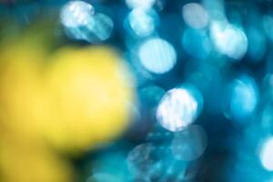 abstract blue and yellow bokeh background, defocused light. photo