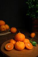 Fresh Orange fruit close up shot. Cinematic style, dark mood photography. orange fruit on the cutting board photo