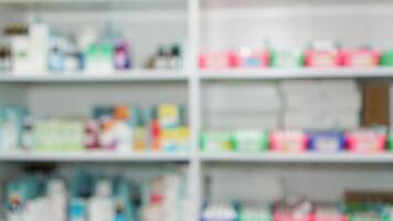 blur abstract background of medicine or drug in shelf in drugstore, pharmacy, clinic, and hospital photo