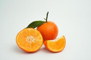 Group of orange fruit consists of whole, piece and half orange isolated on white background photo