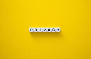 Privacy word on yellow background photo