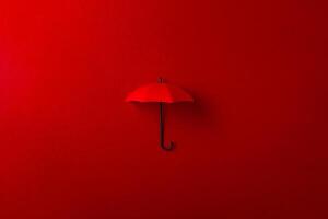 Red umbrella isolated on purple background. photo