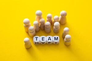 Wooden Figurine with the word TEAM. Business Conceptual photo