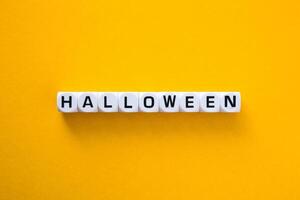 Halloween word on a yellow background. photo