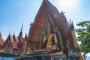 kanchanaburi.thailand-16.1.2022 unacquainted people at Wat Tham Suea Tiger Cave Temple kanchanaburi.An 18-meter-tall Buddha built in 1973 is the focus of this well-known temple on a hilltop. photo