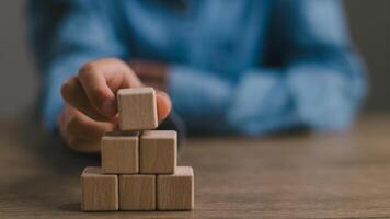 Blank wooden cubes on the table with copy space, empty wooden cubes for input wording, and an infographic icon. photo