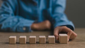 Blank wooden cubes on the table with copy space, empty wooden cubes for input wording, and an infographic icon. photo