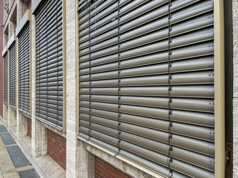 windows with lowered shutters photo