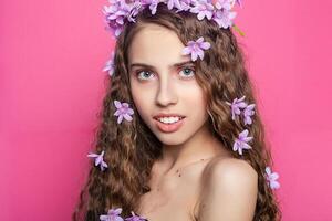 Beautiful girl with flowers in in hair photo