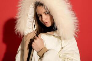 girl white jacket poses red background photo