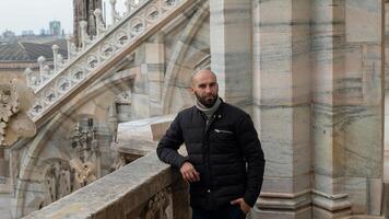 Happy man in front of Duomo Milan Cathedral photo