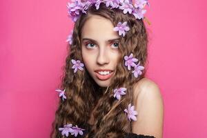 Beautiful girl with flowers in in hair photo